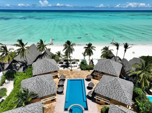 Aerial view of a beach resort and pool on the Zanzibar coast