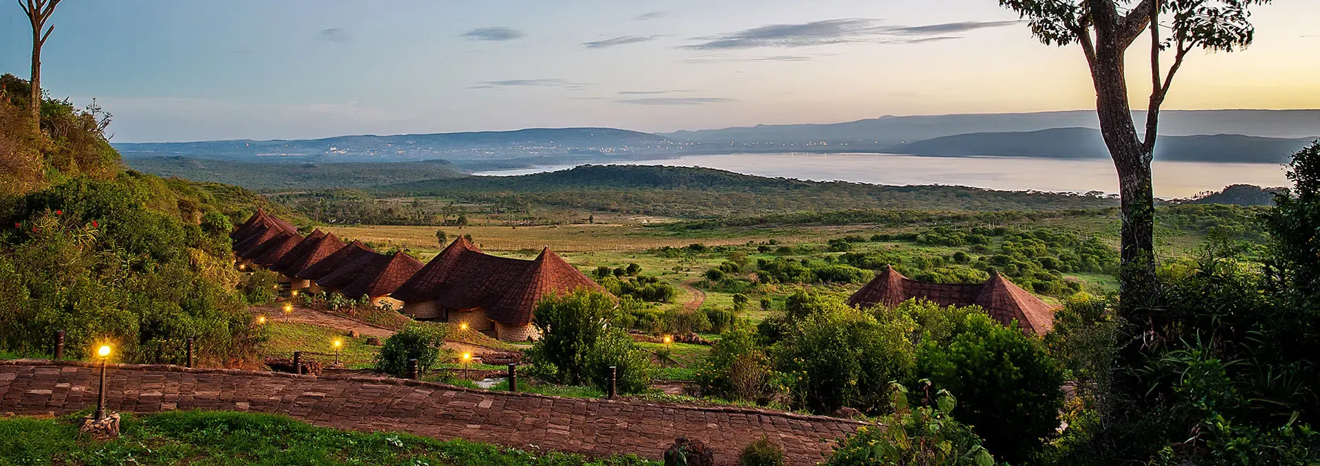 Safari lodge at dusk above the Rift Valley floor