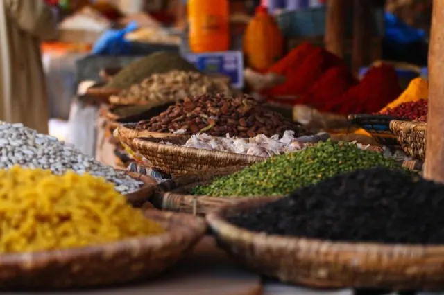 Spices displayed in baskets at a Zanzibar spice farm